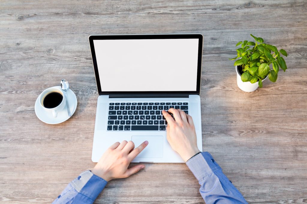 Person's Hand on Laptop